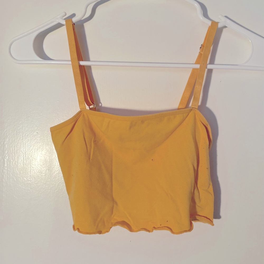 Yellow crop tank.